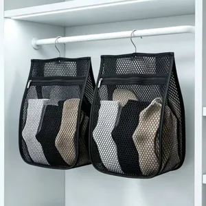 Hanging mesh storage bag detail showing black breathable organizer with socks inside closet