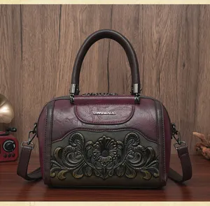 Retro embossed women's handbag, vintage style shoulder cross body bag with top handle.