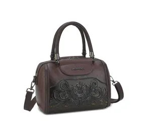 Retro embossed women's handbag detail, premium dark brown leather shoulder bag close up.