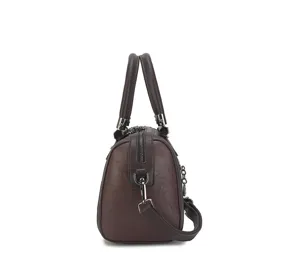 Side view detail of a classic brown retro women leather shoulder crossbody bag with sturdy top handle.