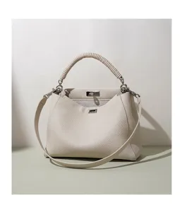 Elegante bolso de cuero beige con asa superior y correa, bolso elegante para uso diario.