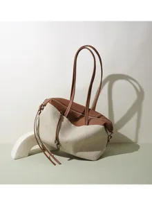 Sac bandoulière en toile et cuir, design minimaliste de navette avec grande capacité.