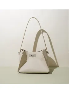 Minimalist bucket shoulder bag detail, premium leather texture, elegant daily accessory.