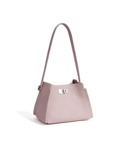 Light pink leather shoulder bag for women, stylish minimalist trapezoid handbag with metal lock.
