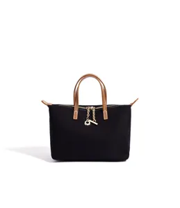 Borsa tote in tela nera con manici in pelle marrone, elegante borsa a tracolla da donna.