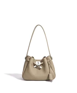 Elegant genuine leather bucket bag with shoulder strap and metal clasp design for daily use.