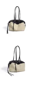 Sac porté épaule Boston en cuir noir et toile beige avec double anses et détails.