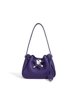 Purple leather shoulder bag, elegant bucket bag with lock, chic minimalist crossbody purse.