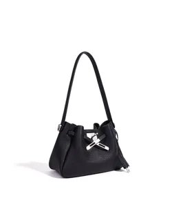 Black leather bucket bag detail showing premium shoulder strap and metal turn-lock clasp design.