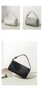 Sac bandoulière cylindrique minimaliste en cuir véritable, élégant sac fourre-tout chic.