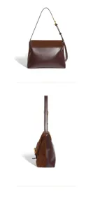 Brown leather and suede shoulder bag detail, vintage underarm commuting handbag for women.