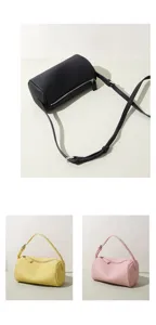 Sac bandoulière cylindre en cuir minimaliste, sac barrel stylé en noir, jaune et rose vif.