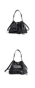 Detailed studio view of the black leather shoulder bag featuring a front pouch and tassel.