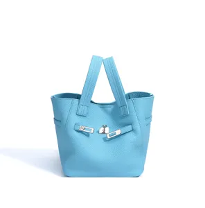 Light blue genuine leather bucket bag for women, elegant top handle tote bag with lock hardware.