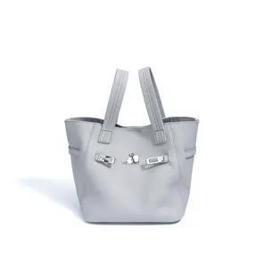 Genuine leather tote bucket bag for women, featuring luxury hardware and large capacity.