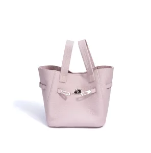 Pink leather bucket handbag with metal lock closure, elegant and spacious design for women.