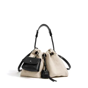 Canvas bucket shoulder bag with black leather trim, braided handle and detachable mini pouch.