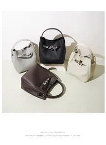 Detailed view of genuine leather bucket bags with metal lock strap hardware in multiple colors.