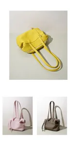 Vista detallada de elegantes bolsos de cuero en colores amarillo, rosa y gris oscuro.