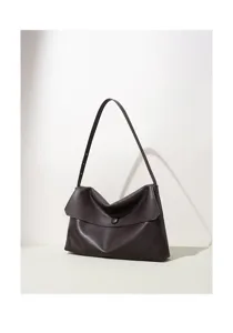 Details of dark brown leather shoulder bag, soft slouchy shape, flap with button, slim strap.