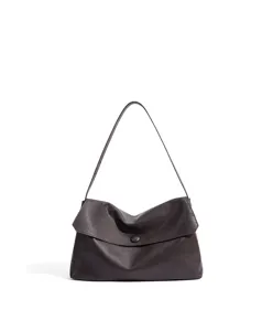 Close-up detail view of the dark brown leather shoulder bag, highlighting the soft texture.