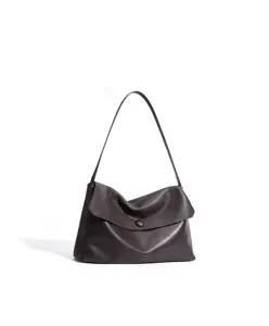 Detailed view of dark brown leather shoulder bag, soft slouchy design with flap and single strap.