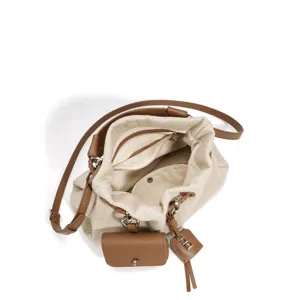 Canvas shoulder bag with brown leather trim, bucket design and stylish small pouch charm.