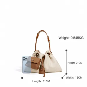 Stylish canvas shoulder bag with brown leather handles, casual tote purse for women daily use.