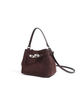 Retro brown suede bucket bag with metal lock closure, versatile crossbody and shoulder use.