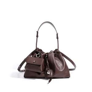 Brown leather slouchy shoulder bag with braided strap, front pouch and chic metal lock charm.