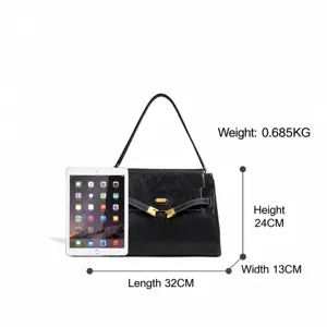 Sac à main minimaliste de luxe en cuir noir pour femme, élégant sac bandoulière de travail.