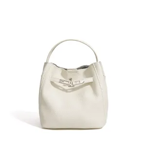 Minimalist white leather bucket bag with top handle and chic metal lock. Elegant women's handbag.