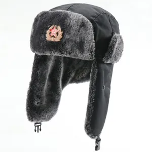 Detailed view of the winter bomber hat with warm earflaps and Soviet star badge.
