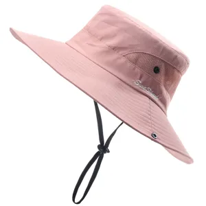 Detail view of the pink sun hat featuring breathable mesh panels and adjustable chin strap.