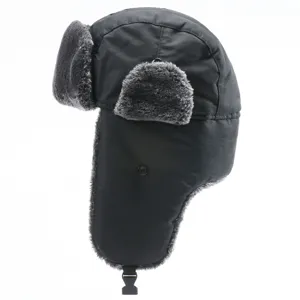 Detailed view of the thick black winter ushanka hat with warm grey faux fur earflaps and windproof design.