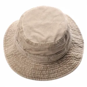 Detailed view of a vintage washed cotton bucket hat in khaki, featuring neat stitching and brim.
