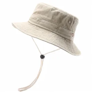 Detail view of khaki washed cotton bucket hat, adjustable chin strap, breathable eyelets.