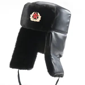 Detailed close-up of winter ushanka hat in black PU leather with faux fur and Soviet star badge.