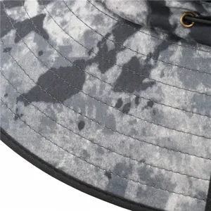 Sun protection fisherman hat detail shot showing fabric texture, waterproof brim and eyelet.