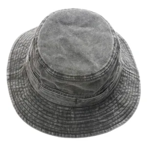 Detailed view of a retro washed cotton bucket hat, sun protection outdoor fishing cap.