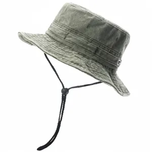 Close-up detail of the washed cotton bucket hat with chin strap and adjustable toggle.