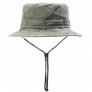 Detail view of the washed cotton bucket hat featuring an adjustable chin strap and brim.