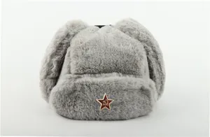 Close-up view of grey faux fur ushanka hat with warm earflaps and vintage red star badge.