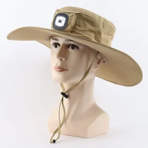 Detailed view of khaki outdoor sun hat featuring front LED lighting and adjustable strap cord.