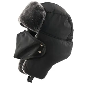 Detail shot of black windproof winter trapper hat with grey faux fur lining and warm earflaps.