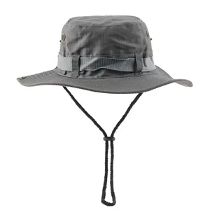 Detail view of a solid grey outdoor bucket hat with adjustable chin strap and breathable eyelets.