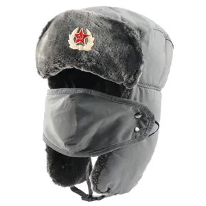 Detail view of the gray winter ushanka hat with plush earflaps, face mask, and soviet badge.