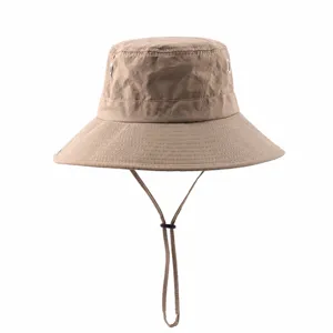 Outdoor sun protection bucket hat with chin strap and quick-dry fabric for hiking and travel.
