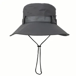 Detail view of dark grey bucket hat with adjustable chin strap and textured decorative band.