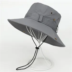 Detailed view of breathable outdoor sun hat brim, mesh eyelets and adjustable chin strap.
